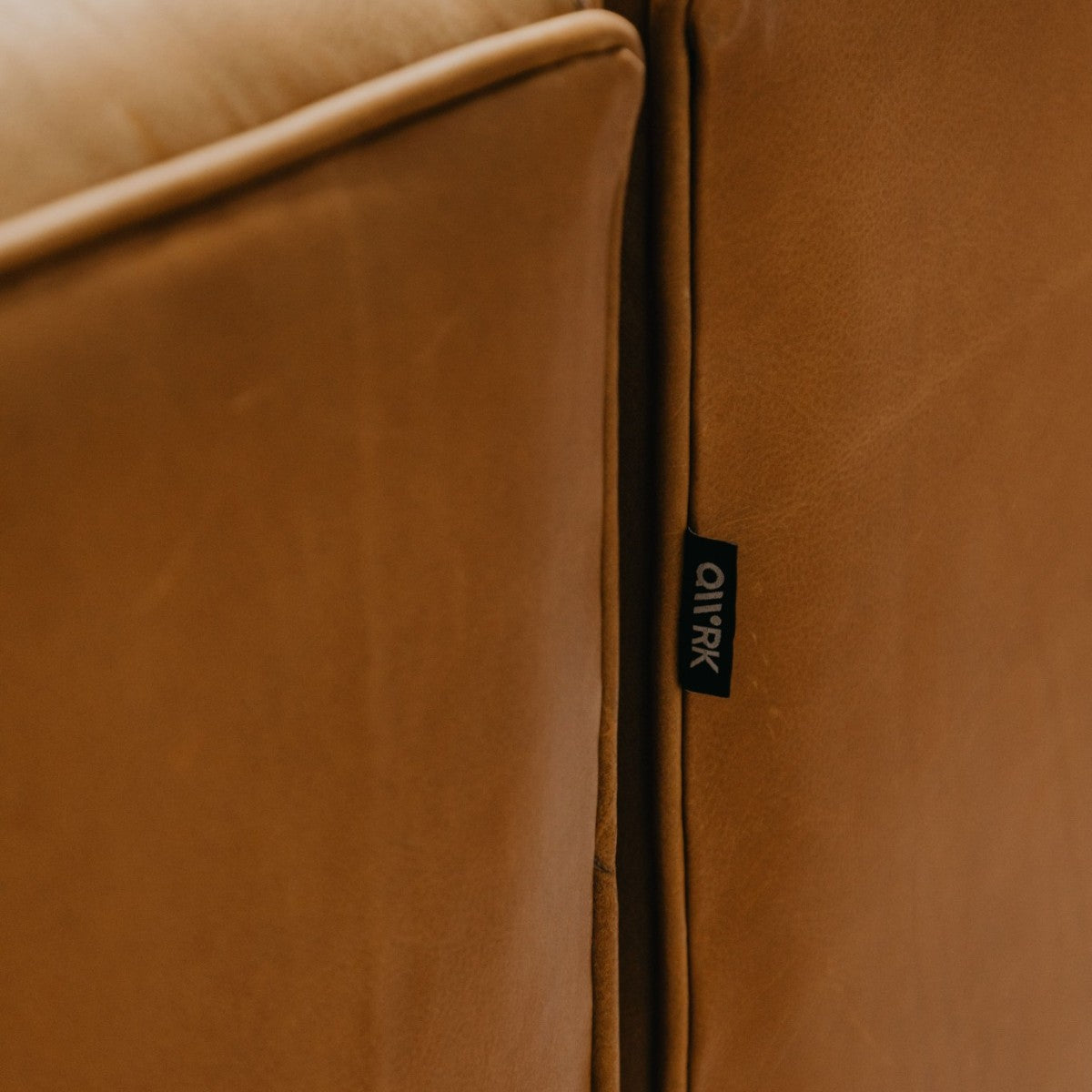HANKI Toren leather sofa brand tag close-up between cushions