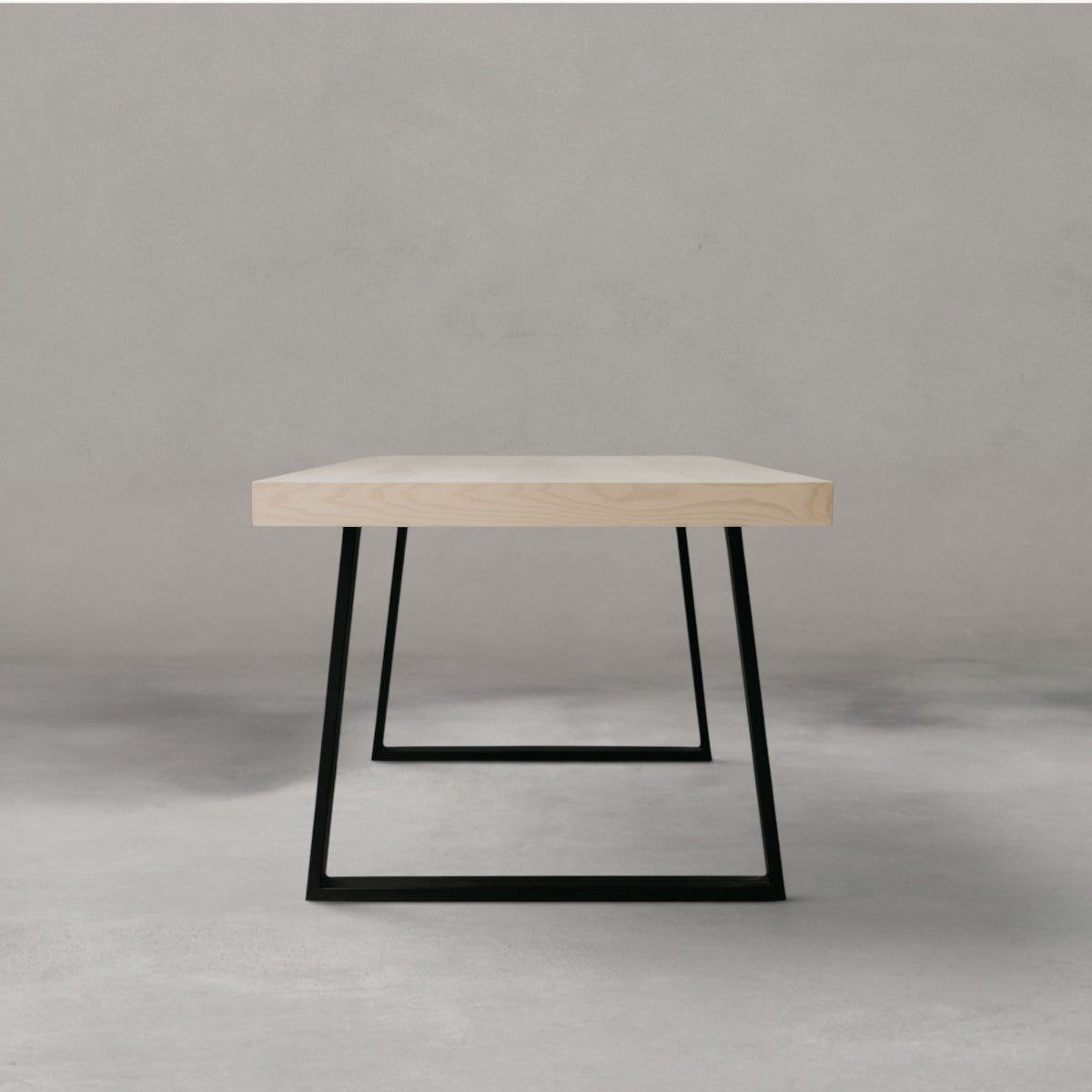 HANKI Caelen dining table front view timber top steel legs