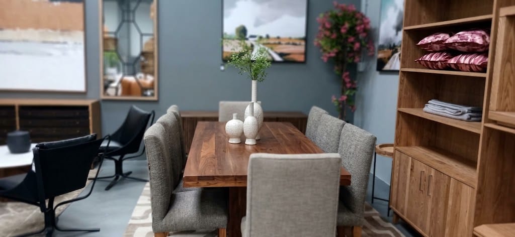 HANKI Thorne dining table styled in showroom with dining chairs and decor 