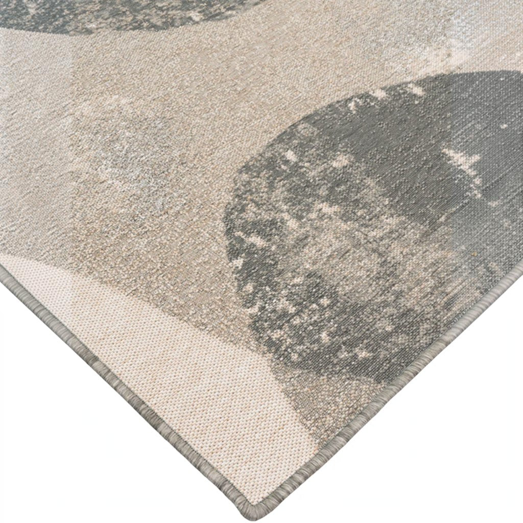 Close-up of HANKI Lichen Stone Rug showing the flat-woven texture and abstract grey and beige rock-inspired pattern