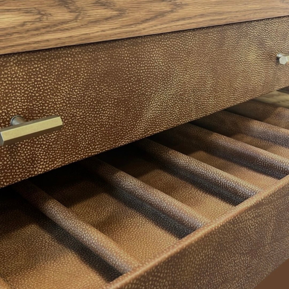 HANKI Reserve wine display open leather-faced drawer detail with bottle racks and brass hardware